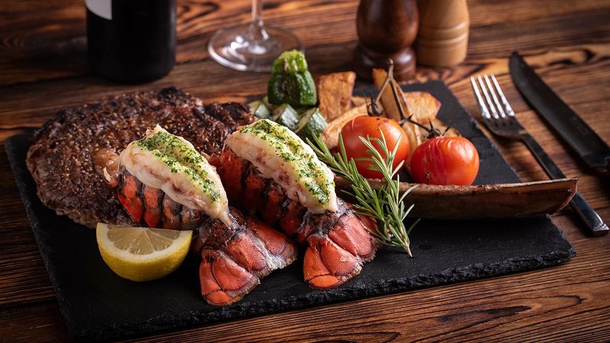 Article Cards Featured Image surf and turf with tomahawk rib eye steak and lobster tail