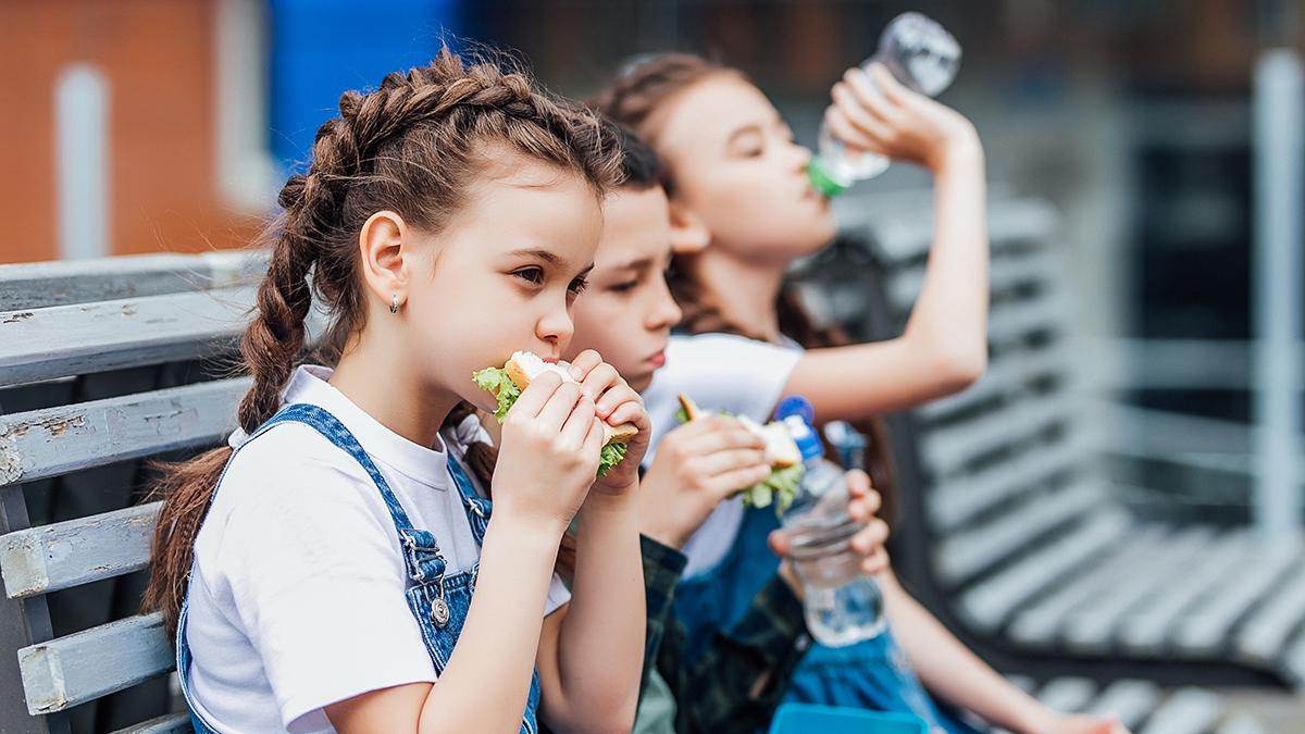 Article Cards Featured Image Three child eat, appetizing school lunch. Healthy school lunch: