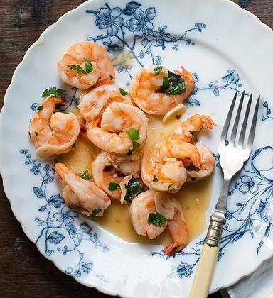 Blue shrimp on a plate showing the difference between shrimp and pawns.